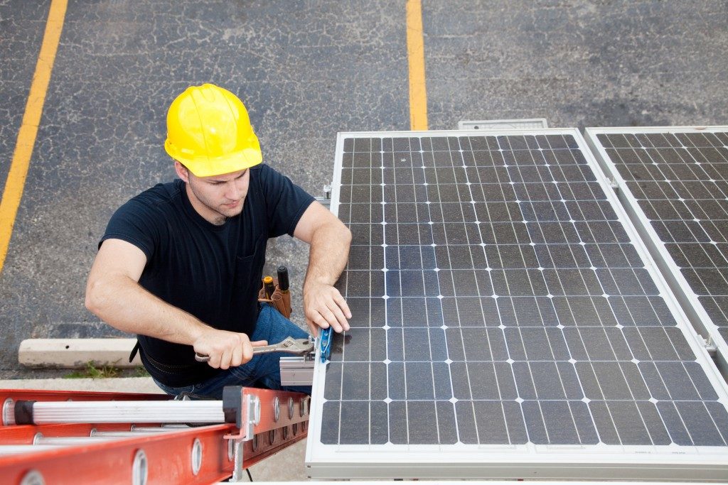 engineer installing portable solar panel